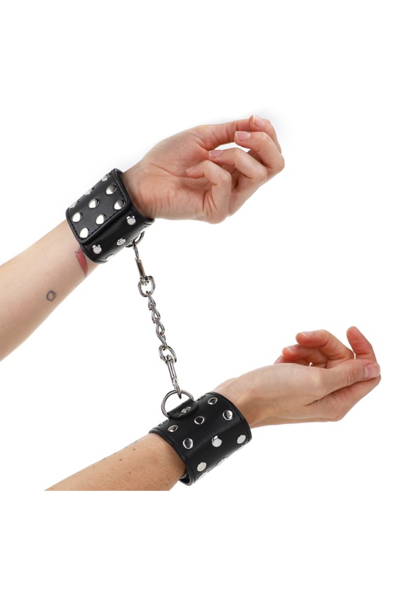 KINK - WRIST RESTRAINTS WITH SNAP FASTEN FULL OF RIVETS BLACK ADJUSTABLE 19-24 CM X 5.5 CM